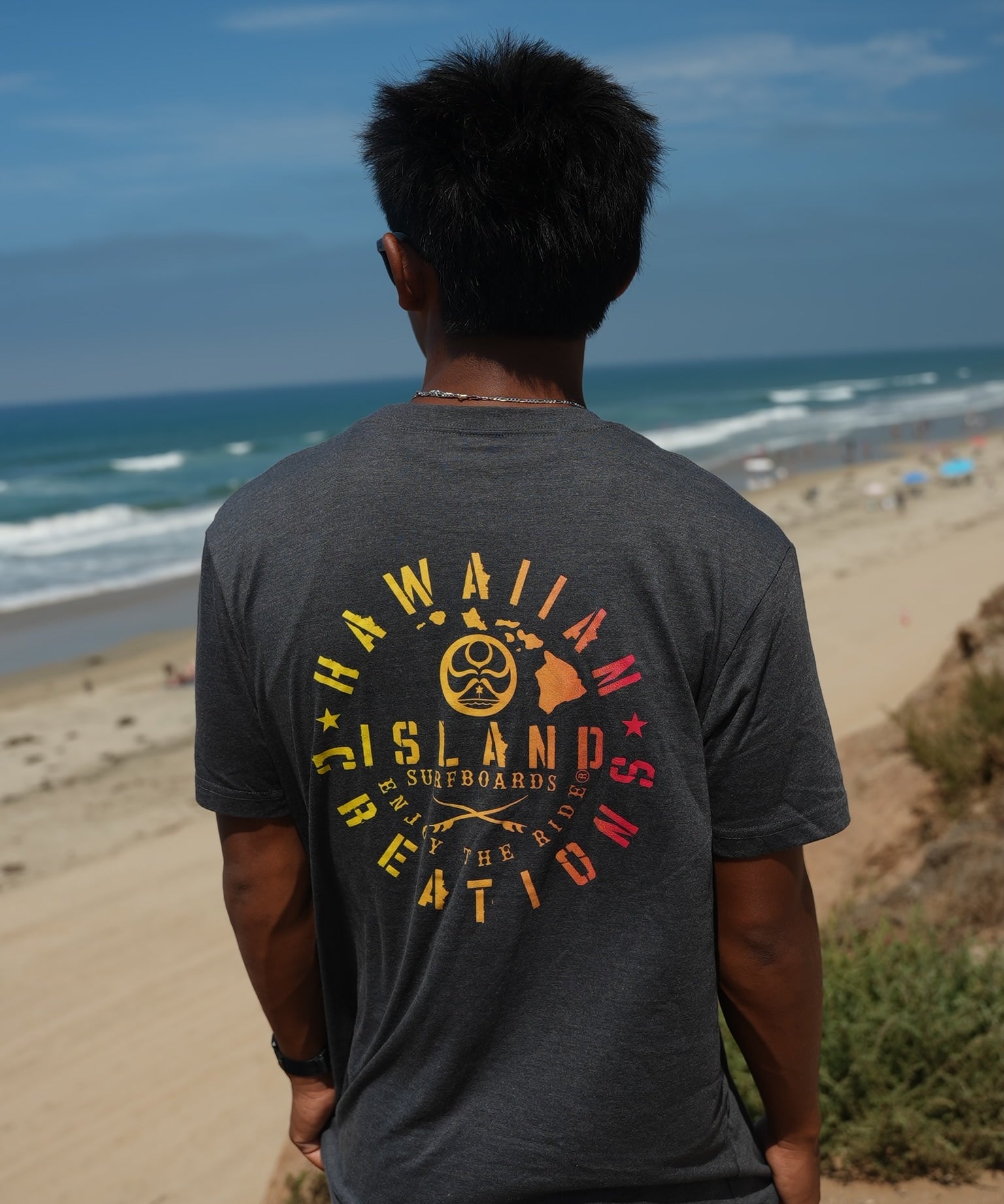 HIC ENJOY THE RIDE Bedrock T-Shirt featuring a graphic design, white fabric, and casual fit, displayed on a hanger.
