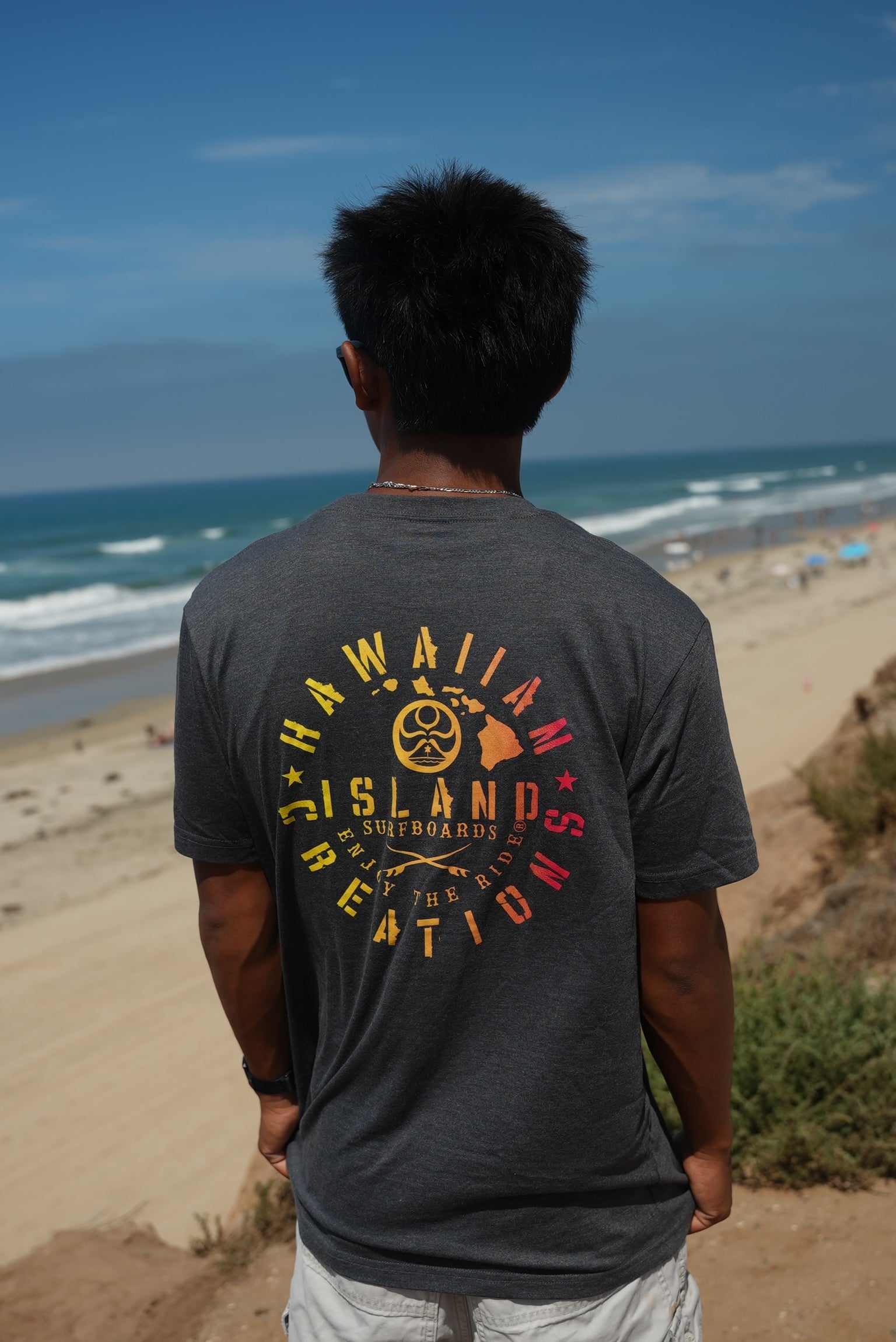 HIC ENJOY THE RIDE Bedrock T-Shirt featuring a graphic design, white fabric, and casual fit, displayed on a hanger.